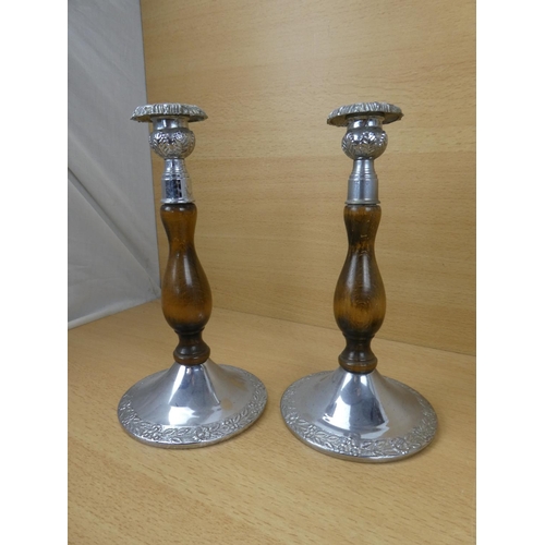 523 - A pair of metal and wood turned candlesticks and another pair.