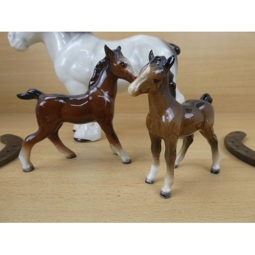 524 - Three pottery figures of horses (a/f), two horse shoes, a cast iron plaque of a horse and lots more.