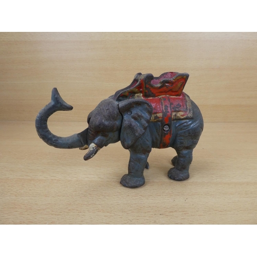 529 - A stunning antique cast iron mechanical money box, modelled as an elephant.