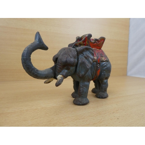 529 - A stunning antique cast iron mechanical money box, modelled as an elephant.