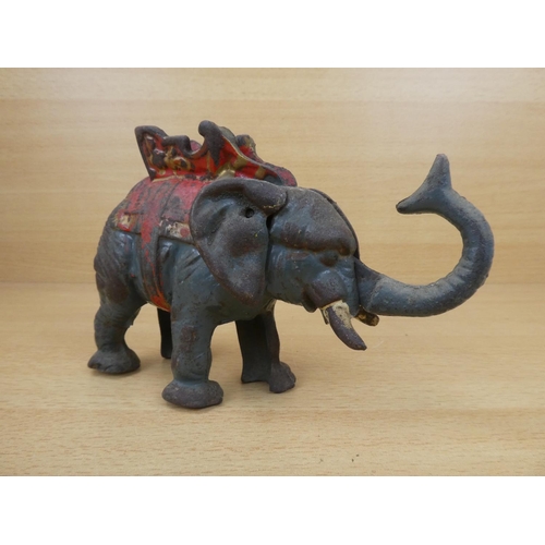 529 - A stunning antique cast iron mechanical money box, modelled as an elephant.