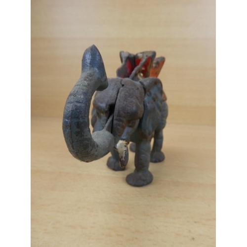 529 - A stunning antique cast iron mechanical money box, modelled as an elephant.