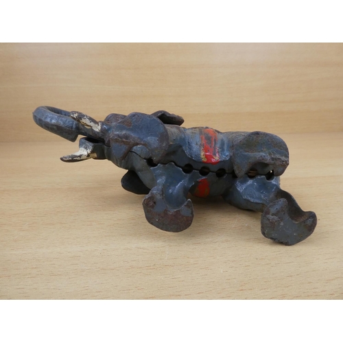 529 - A stunning antique cast iron mechanical money box, modelled as an elephant.