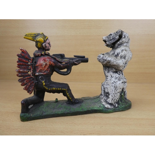 530 - A stunning antique cast iron mechanical money box, modelled as an Indian shooting a white bear. (a/f... 