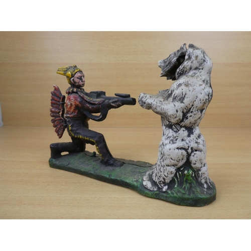 530 - A stunning antique cast iron mechanical money box, modelled as an Indian shooting a white bear. (a/f... 