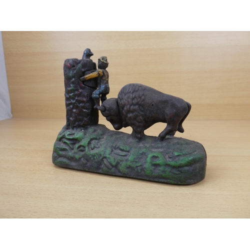 531 - A stunning antique cast iron mechanical money box, modelled as a Buffalo chasing a boy up a tree. 'R... 