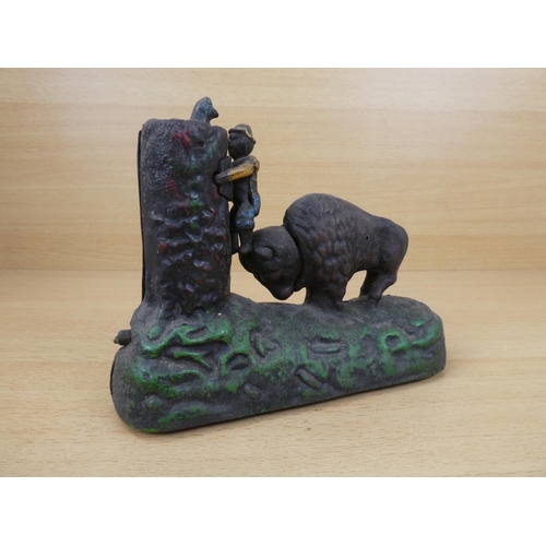 531 - A stunning antique cast iron mechanical money box, modelled as a Buffalo chasing a boy up a tree. 'R... 