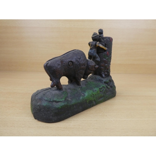 531 - A stunning antique cast iron mechanical money box, modelled as a Buffalo chasing a boy up a tree. 'R... 