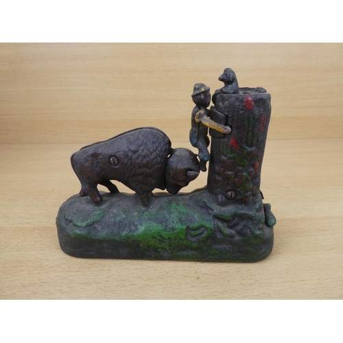 531 - A stunning antique cast iron mechanical money box, modelled as a Buffalo chasing a boy up a tree. 'R... 