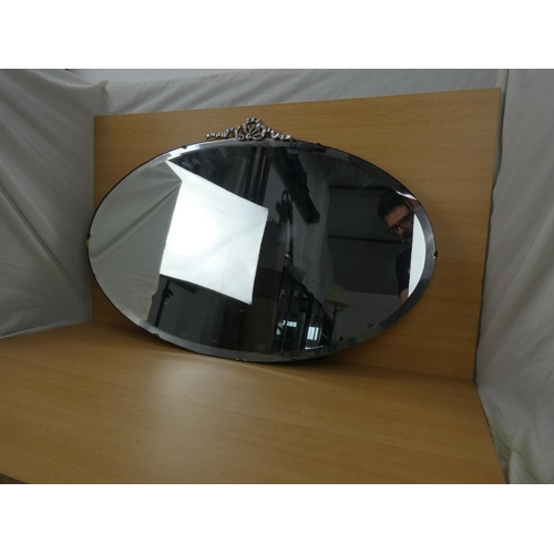 546 - A stunning vintage frameless mirror, measuring 49x76cm.