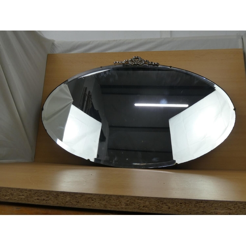 546 - A stunning vintage frameless mirror, measuring 49x76cm.