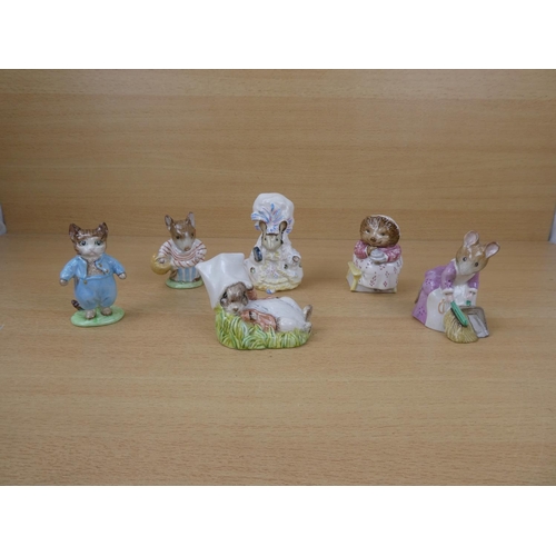 551 - A collection of six Beswick Beatrix Potter ornaments to include Mrs Tittlemouse, Hunca Munca Sweepin... 