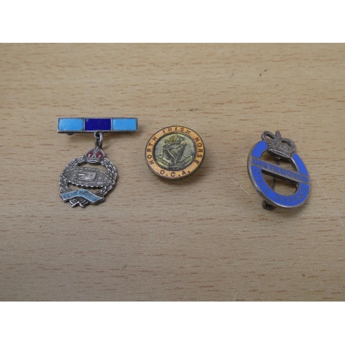 555 - A vintage Instructor Civil Defence badge, a North Irish Horse O.C.A. badge and Fear Naught Tank Regi... 