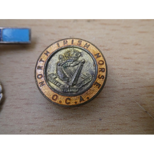 555 - A vintage Instructor Civil Defence badge, a North Irish Horse O.C.A. badge and Fear Naught Tank Regi... 