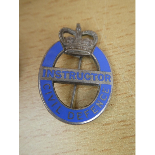 555 - A vintage Instructor Civil Defence badge, a North Irish Horse O.C.A. badge and Fear Naught Tank Regi... 