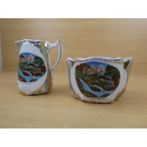 558 - A vintage souvenir jug and bowl 'Dog Leap, Limavady'.