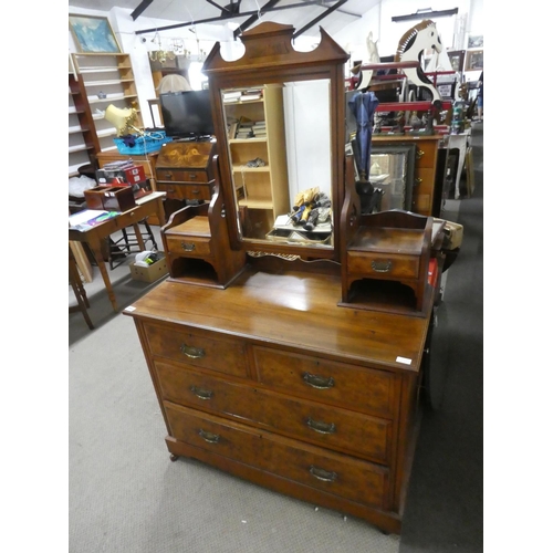 559 - An antique mahogany dressing table with walnut panels, measuring 107x170x49cm.