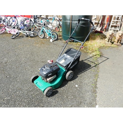 595 - A Qualcast petrol lawnmower.