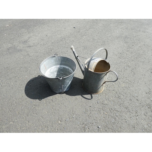 598 - A vintage metal bucket and watering can.