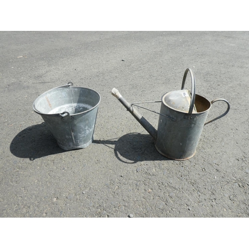 598 - A vintage metal bucket and watering can.