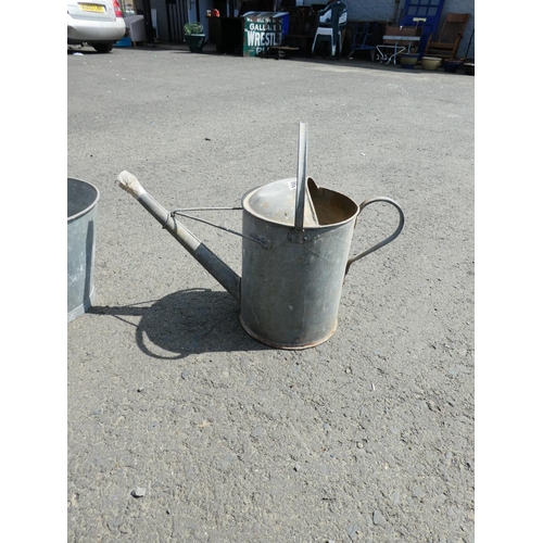 598 - A vintage metal bucket and watering can.