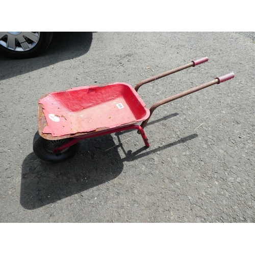 608 - A vintage children's wheelbarrow, made in Japan.