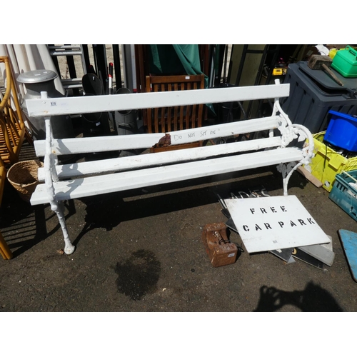 618 - A garden bench with grape and vine cast iron ends. In need of restoration.