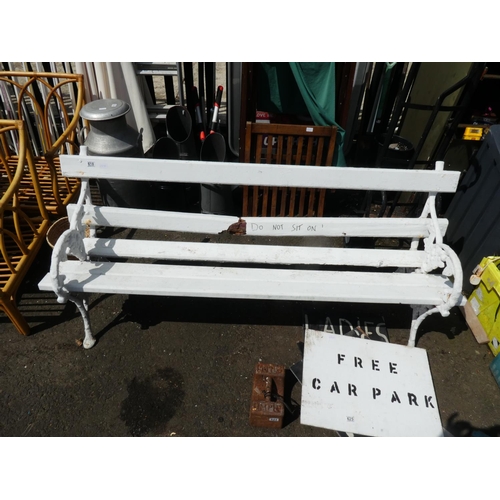 618 - A garden bench with grape and vine cast iron ends. In need of restoration.