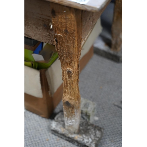 133 - An Irish vernacular pine table, in need of extensive restoration.