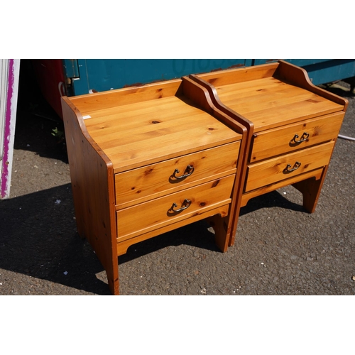 22 - A pair of pine bedside lockers.