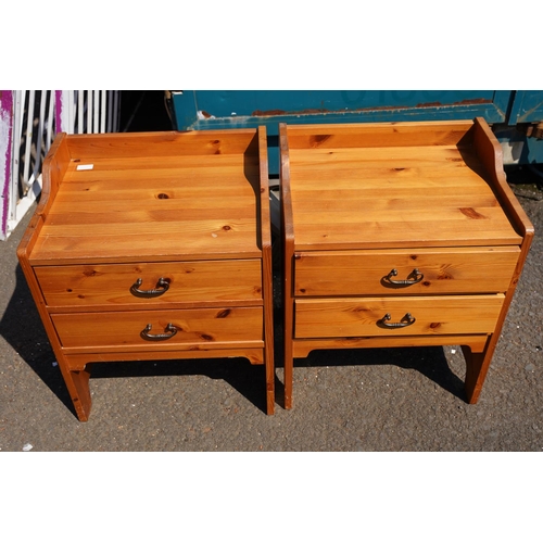 22 - A pair of pine bedside lockers.