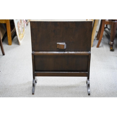 34 - An antique fire screen with decorative embroidery / needlework.