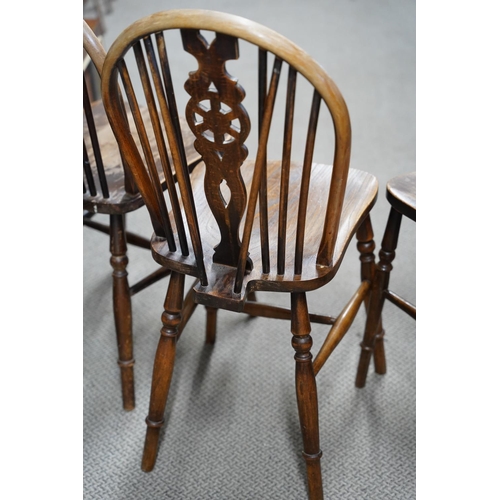 36 - A set of 4 vintage chairs with decorative back splats.