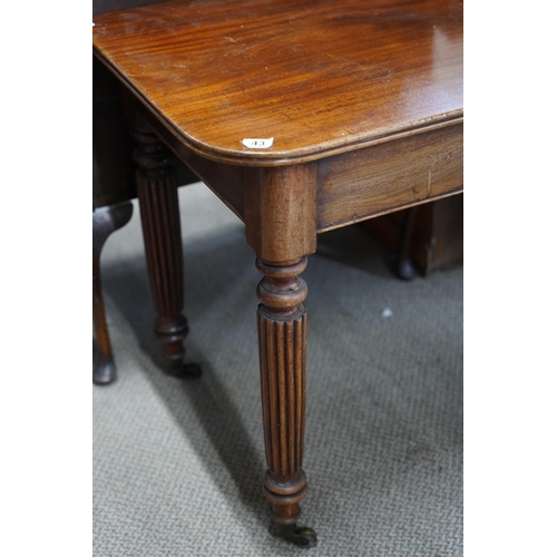 43 - An antique 'D' end table on castors.