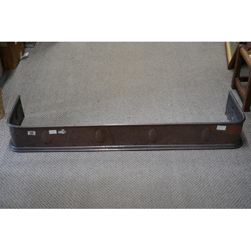 49 - An antique copper fire surround.