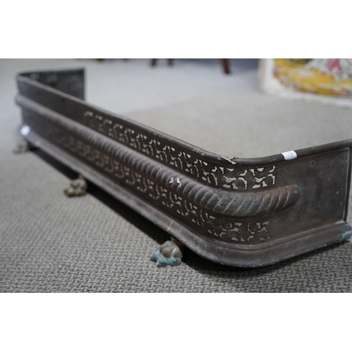 85 - A stunning antique copper fire surround on claw feet.