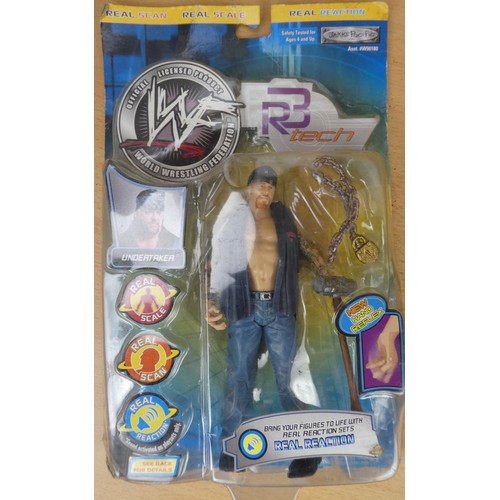 54 - Three boxed Wrestling figures.