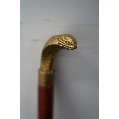 84 - A brass snake head walking stick.