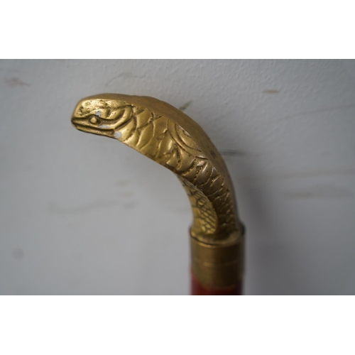 84 - A brass snake head walking stick.