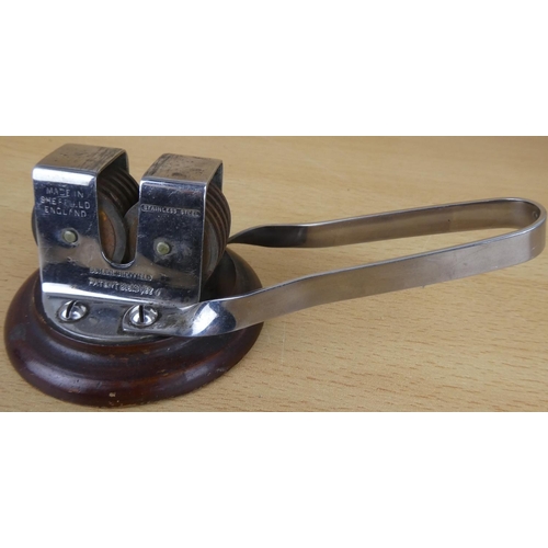 23 - A vintage Butler, Sheffield stainless steel sharpener.