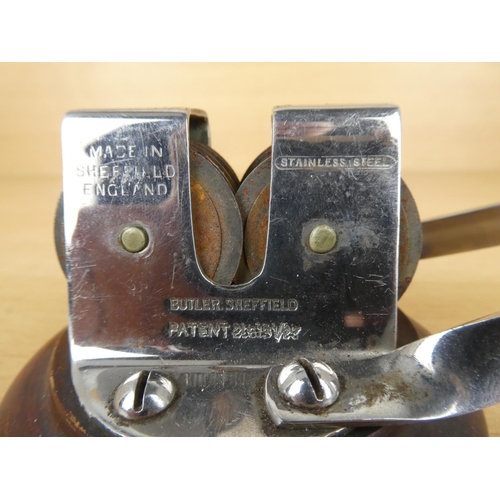 23 - A vintage Butler, Sheffield stainless steel sharpener.