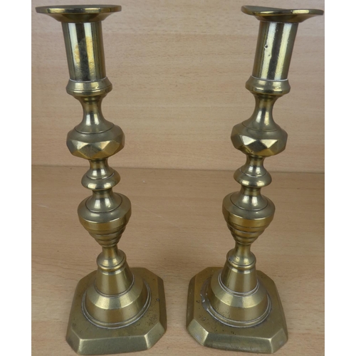 25 - A pair of brass candlesticks.