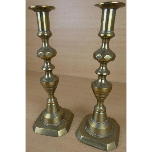 25 - A pair of brass candlesticks.