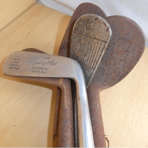 35 - A collection of antique wooden shafted golf clubs.