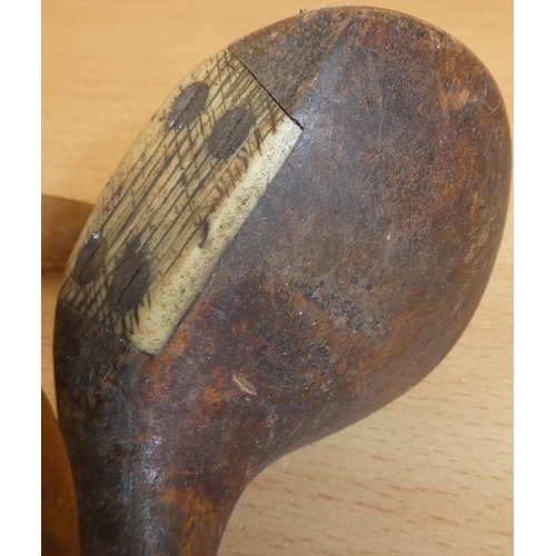 35 - A collection of antique wooden shafted golf clubs.