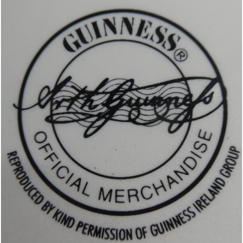 56 - A 'Guinness for Strength' pottery pub jug (small chip to base).