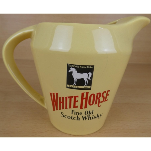 58 - A vintage Wade White Horse Scotch Whisky pub jug.