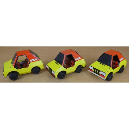 62 - Three vintage tin plate toy cars.