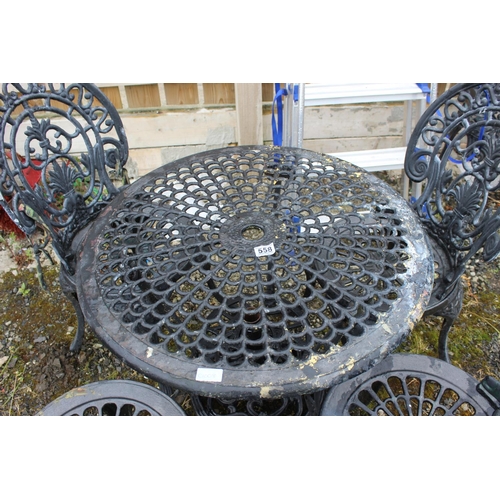 558 - A stunning metal garden table and four chair set, including parasol base.