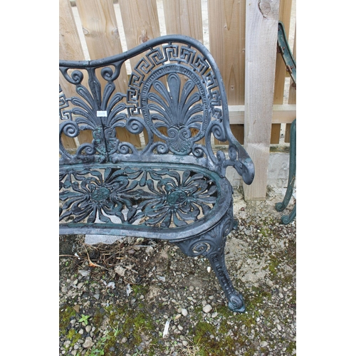 559 - A decorative cast metal garden bench.